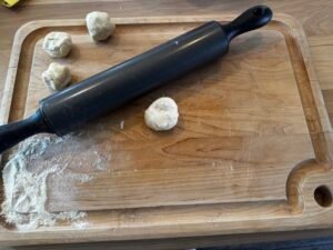Flour tortilla dough balls, use light dusting of flour to prevent sticking